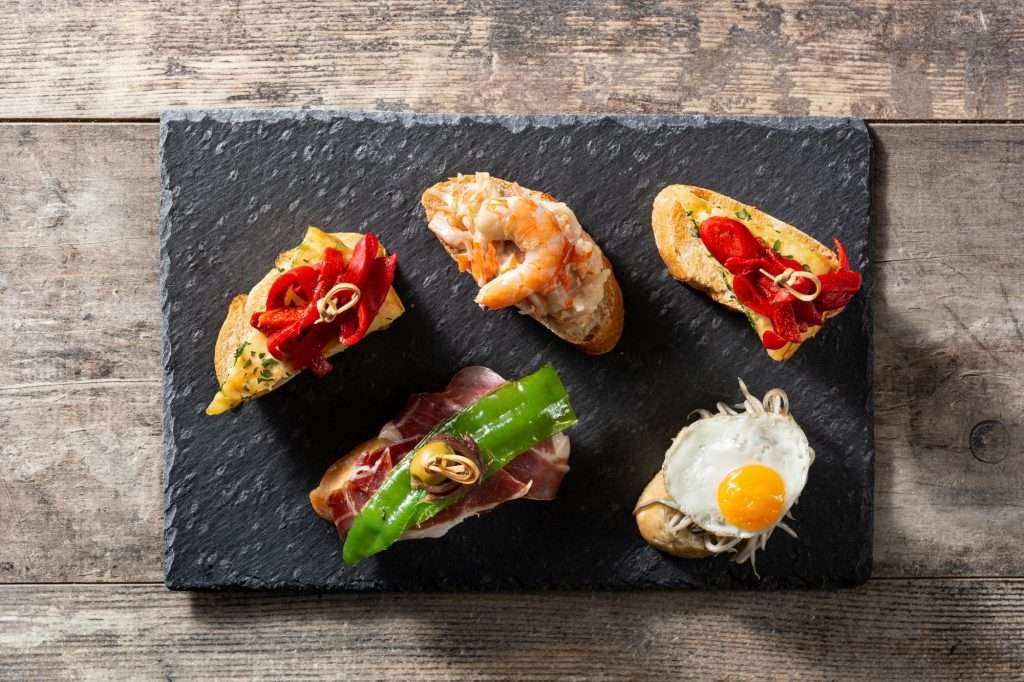 assortment-spanish-pintxos Pintxos pinchos españoles Restaurante La Cocina de Hande